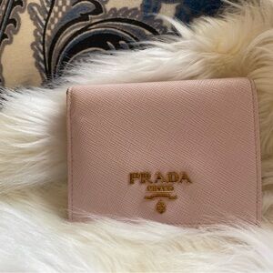 Prada small saffiano leather wallet in good used condition.